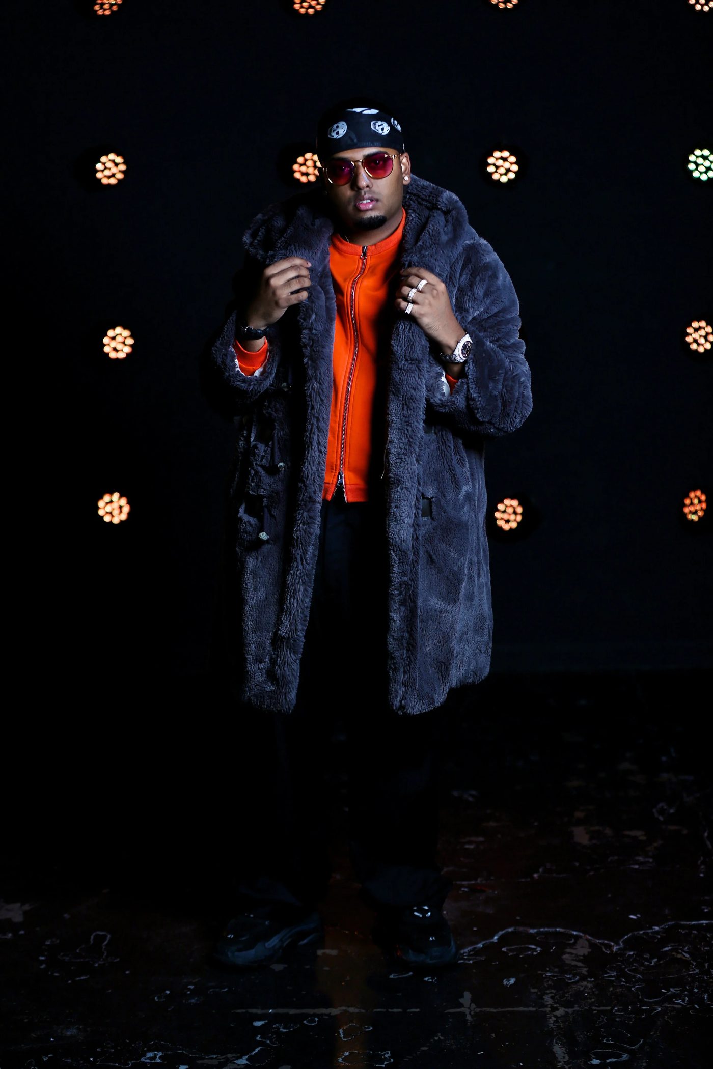 DJ SpinKing under amber stage lights